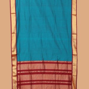 Blue plain nine-yard cotton saree, contrast traditional zari border, and pallu of traditional design